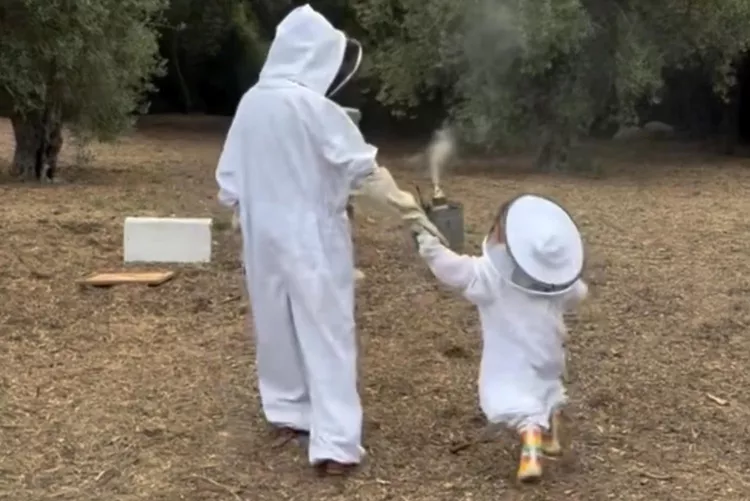 Meghan Markle walks with her daughter Princess Lilibet.