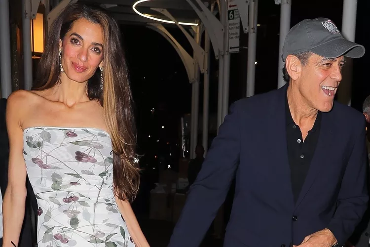 American actor and filmmaker George Clooney and wife Amal Clooney are seen holding hands as they leave Polo Bar in New York City.
